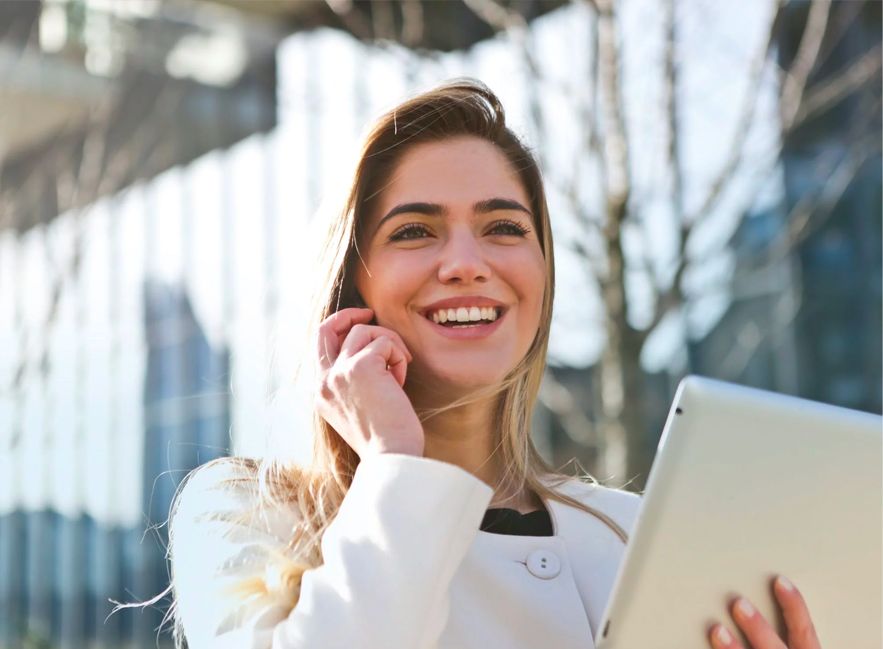 Woman on Mobile Phone Holding Tablet Woman on Mobile Phone Holding Tablet